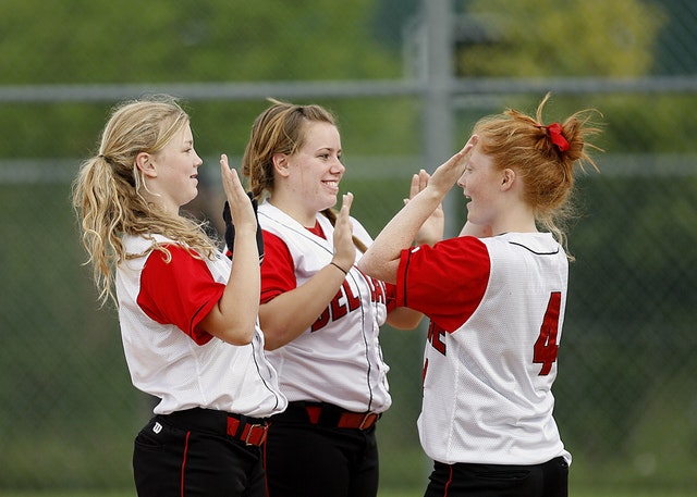 image of girls softball teammates