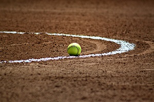 softball on the ground of a field