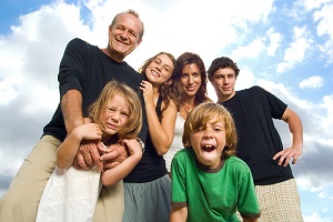family smiling at camera