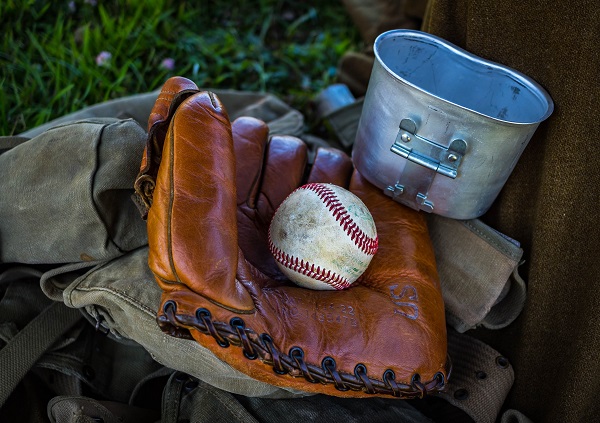 Baseball mitt and baseball Sports camp insurance